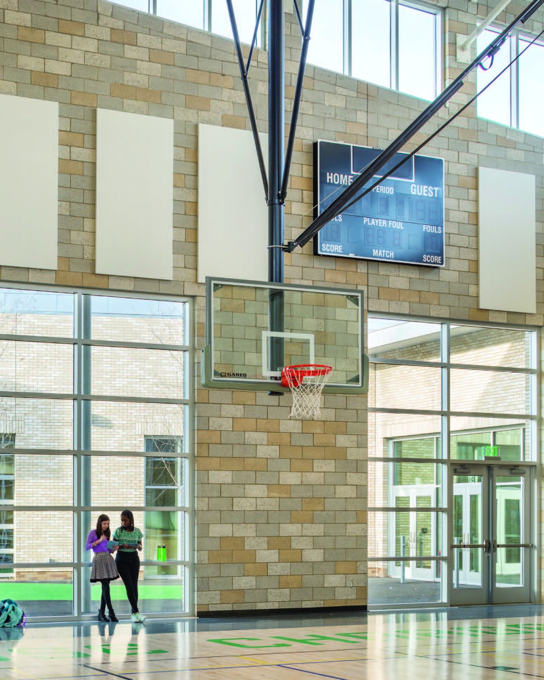 Basketball court with tall windows and durable concrete masonry walls