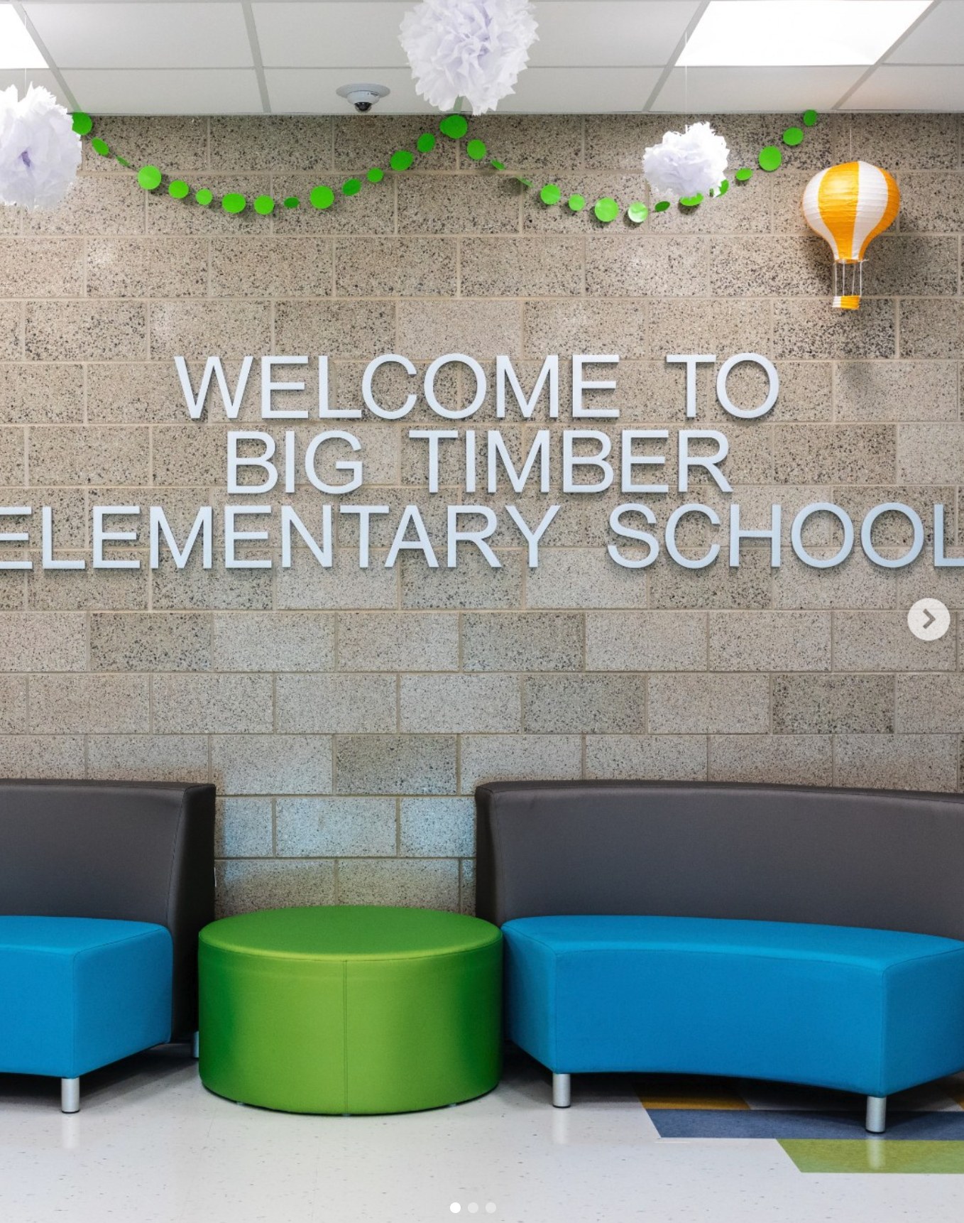 Welcoming Big Timber Elementary School entrance with colorful seating and concrete masonry